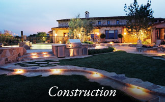 Landscape construction — illuminated residential property at dusk